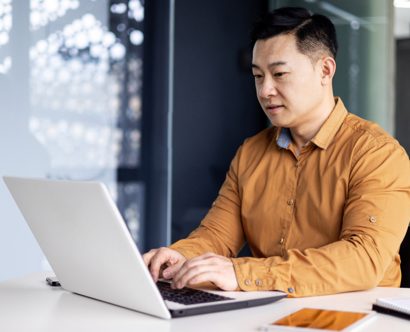 Man Using Servicenow On Laptop