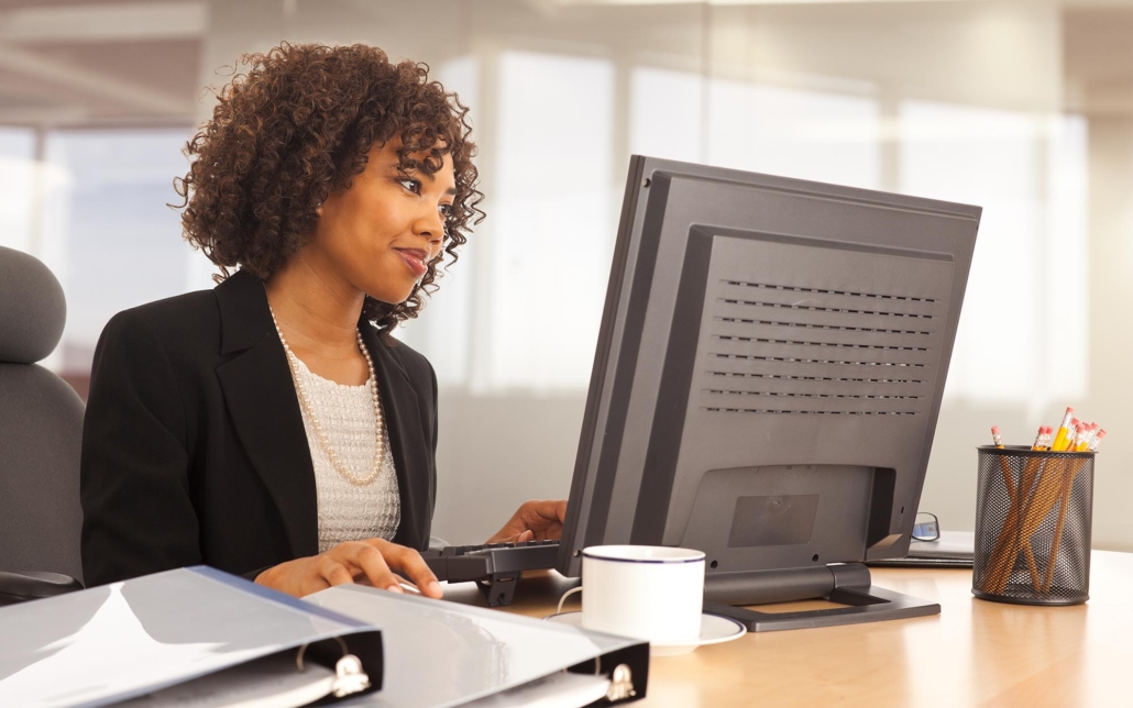 Tech Professional On Computer In Office