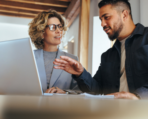 Business Man Having A Discussion With His Colleague In An Office