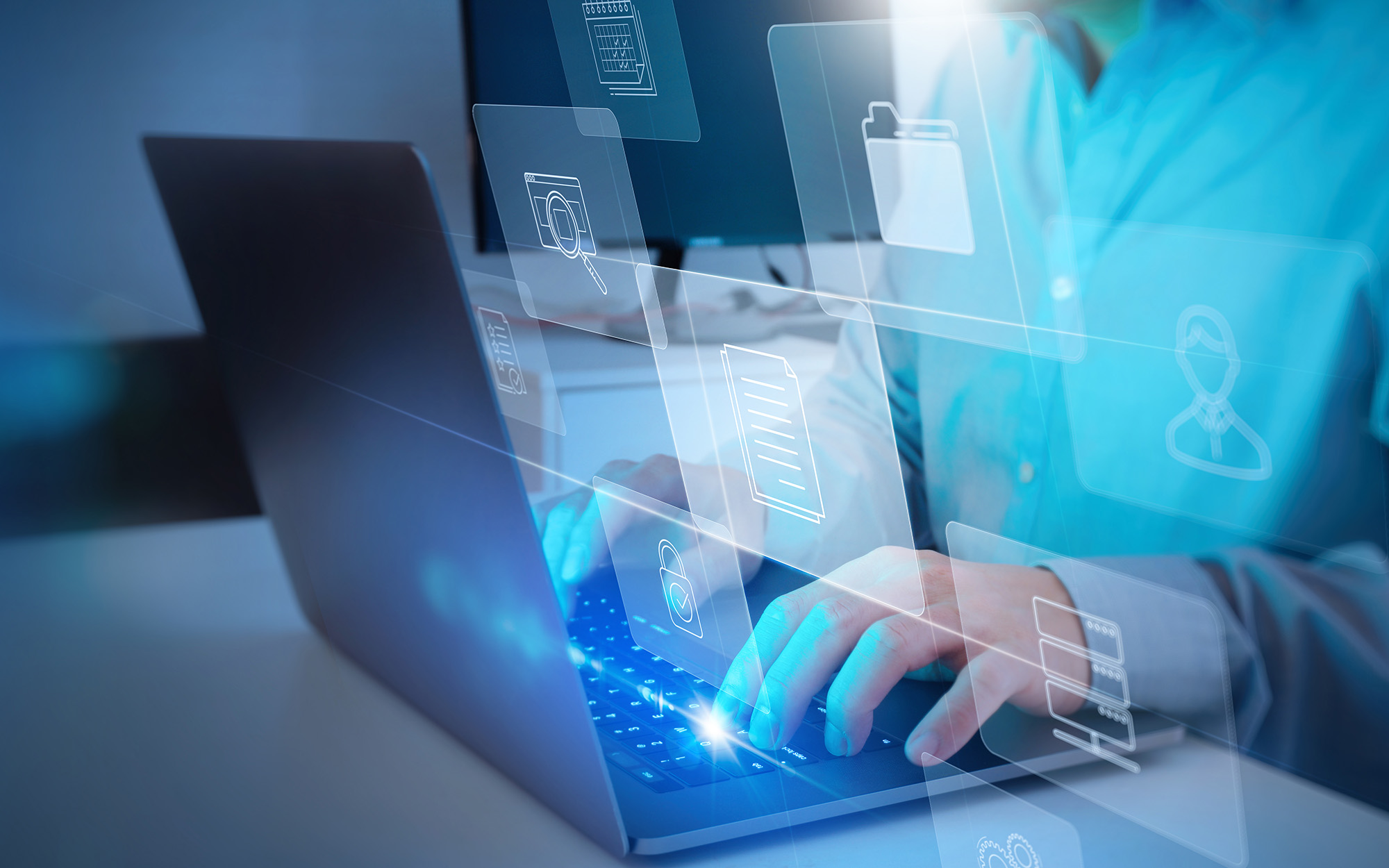 Businessman Working With Laptop Computer With Icons On Virtual Screen