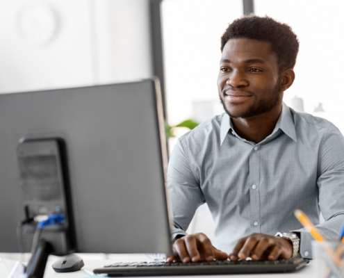 Businessman With Computer Working At Office