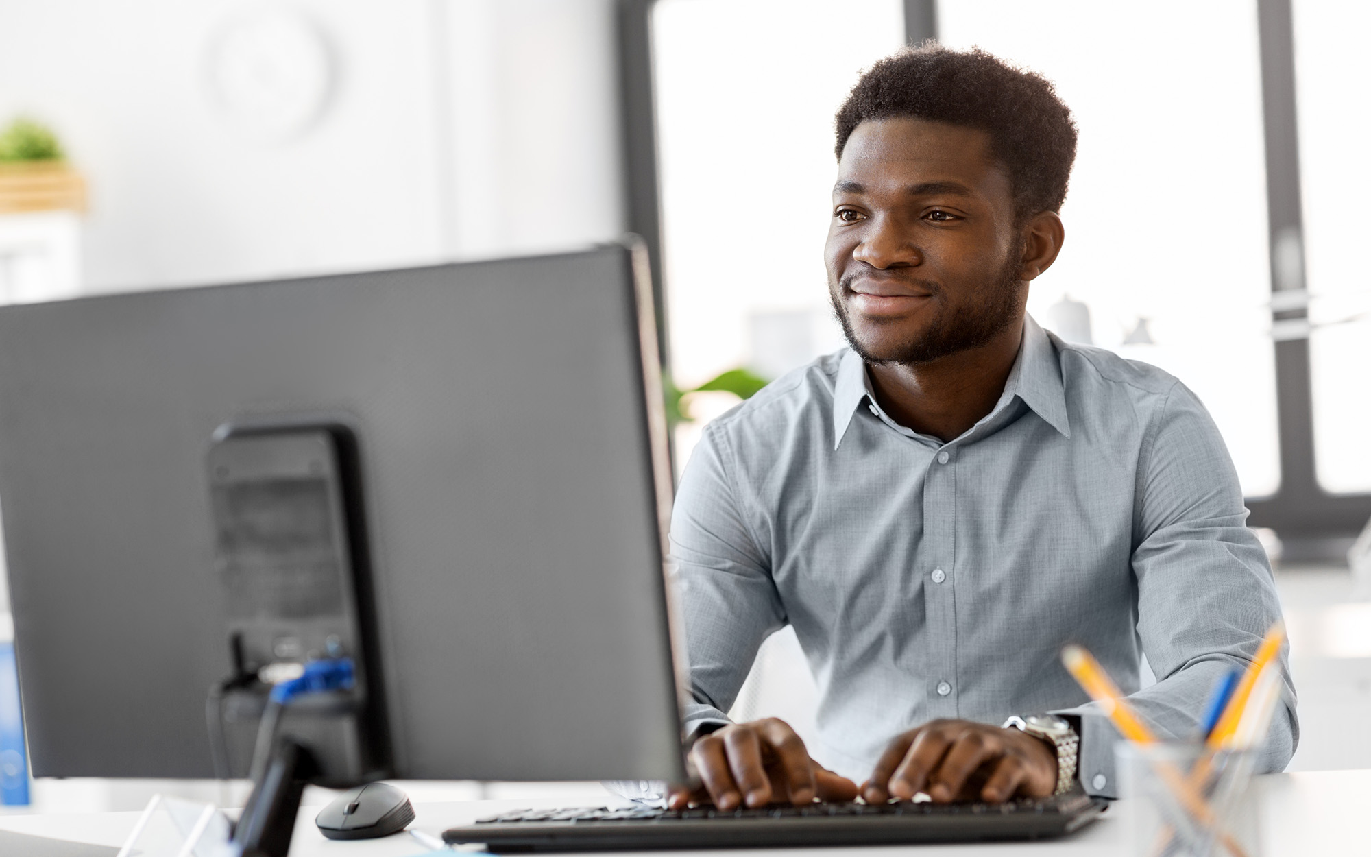 Businessman With Computer Working At Office