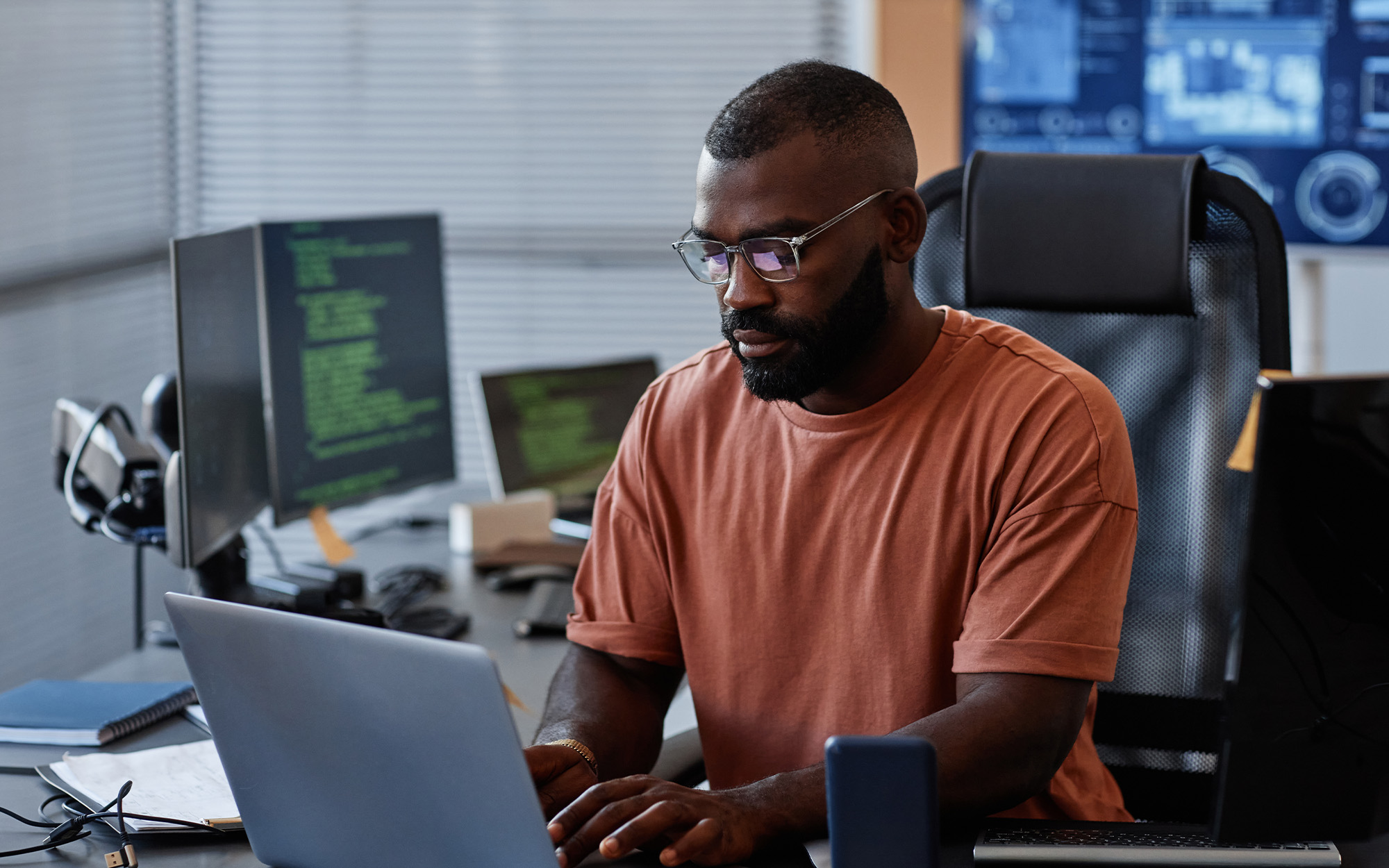 Portrait Of Black Software Engineer Using Computer In High Technology Office