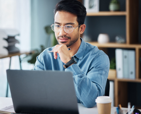 Business Man Thinking At Laptop In Office For Startup Management